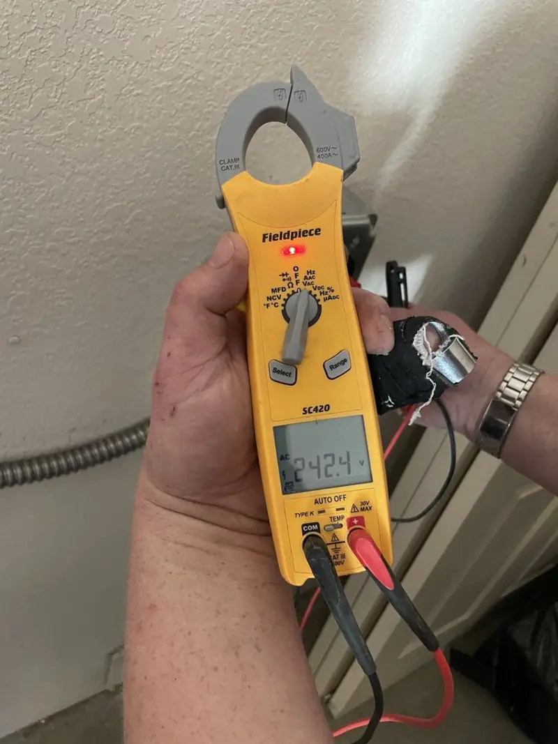 Voltage testing with clamp meter during Outlet Installation in Alameda